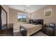 Bedroom features a dark wood bed frame, light beige walls and large window with neighborhood view at 3277 E Meadowview Dr, Gilbert, AZ 85298