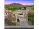 Attractive home with an attached two-car garage, stone accents and lush desert landscape with mountain views at 3277 E Meadowview Dr, Gilbert, AZ 85298