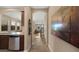 Inviting home hallway with tiled floors, decorative art, and seamless flow into the living spaces at 3277 E Meadowview Dr, Gilbert, AZ 85298
