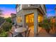 The outdoor patio features a cozy dining area with plush furniture and a covered seating area at 3277 E Meadowview Dr, Gilbert, AZ 85298