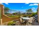 Outdoor patio with a seating area and views of a well-maintained lawn and golf course at 3277 E Meadowview Dr, Gilbert, AZ 85298
