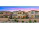 Back of home features multi-story living with view fence and lush landscaping in a well-kept yard at 3277 E Meadowview Dr, Gilbert, AZ 85298
