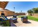 Spacious backyard featuring a well-maintained lawn, patio seating, and a serene atmosphere at 3536 W Cholla St, Phoenix, AZ 85029