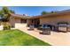Landscaped backyard with patio seating, a built-in grill, and ample space for activities at 3536 W Cholla St, Phoenix, AZ 85029