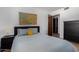 Cozy bedroom featuring a queen bed, modern decor, and natural light at 3536 W Cholla St, Phoenix, AZ 85029