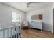 Bright Bedroom with a crib, dresser, rocking chair, and ample natural light at 3536 W Cholla St, Phoenix, AZ 85029