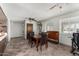 Dining area with a large table, seating for four, and views into the backyard at 3536 W Cholla St, Phoenix, AZ 85029