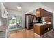 Well-appointed kitchen with stainless steel appliances and sliding doors to the backyard at 3536 W Cholla St, Phoenix, AZ 85029
