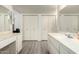 A spacious bathroom featuring dual sinks and a large closet at 3901 W Augusta Ave, Phoenix, AZ 85051