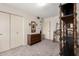 A bedroom with carpet, a closet, and traditional furniture at 3901 W Augusta Ave, Phoenix, AZ 85051