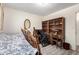 Bedroom featuring wood-look floors, a desk, and wheelchair, and a window with natural light at 3901 W Augusta Ave, Phoenix, AZ 85051