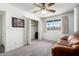 Bright bedroom with neutral walls, carpet, closet, and a window overlooking the neighborhood at 3901 W Augusta Ave, Phoenix, AZ 85051