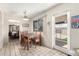 Bright dining area with access to the patio, with white door and trim at 3901 W Augusta Ave, Phoenix, AZ 85051