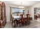 Bright dining room with wood floors, chandelier, and view from the window at 3901 W Augusta Ave, Phoenix, AZ 85051