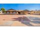 Charming single-story brick home featuring a carport and low-maintenance desert landscaping at 3901 W Augusta Ave, Phoenix, AZ 85051