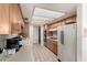 Bright kitchen with tiled floors, oak cabinets, and white appliances at 3901 W Augusta Ave, Phoenix, AZ 85051