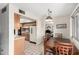 Well-lit kitchen with tiled floors, light oak cabinets, and access to dining area at 3901 W Augusta Ave, Phoenix, AZ 85051