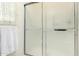 Close-up of a shower with glass doors and white towel at 3901 W Augusta Ave, Phoenix, AZ 85051