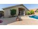 Expansive backyard with pool, patio, and privacy landscaping, perfect for outdoor living at 42277 W Chisholm Dr, Maricopa, AZ 85138