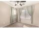 Bedroom featuring neutral walls, ceiling fan and natural light at 42277 W Chisholm Dr, Maricopa, AZ 85138