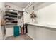 Walk-in closet offering ample storage with built-in shelving and hanging rods at 42277 W Chisholm Dr, Maricopa, AZ 85138