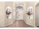 Elegant entryway with decorative niches, a chandelier, and neutral color palette at 42277 W Chisholm Dr, Maricopa, AZ 85138