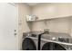 Laundry room featuring new Samsung washer and dryer at 42277 W Chisholm Dr, Maricopa, AZ 85138