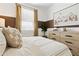 Comfortable bedroom with camping themed decor and natural light from the window at 46422 W Lander Ln, Maricopa, AZ 85139