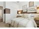 Comfortable bedroom with camping themed decor and natural light from the window at 46422 W Lander Ln, Maricopa, AZ 85139