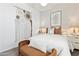 Cozy bedroom featuring modern decor, a comfortable bed, and an ornate wall decoration at 46422 W Lander Ln, Maricopa, AZ 85139