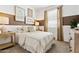 Cozy bedroom featuring natural light, a comfortable bed, and camping themed decor at 46422 W Lander Ln, Maricopa, AZ 85139