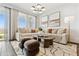 Living room features a large sectional sofa, stylish coffee table, and modern decor at 46422 W Lander Ln, Maricopa, AZ 85139