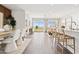Bright living space features an open floor plan, bar seating and access to an outdoor living area at 46422 W Lander Ln, Maricopa, AZ 85139