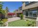 View of a backyard with green lawn and a built in grill with a sink at 4700 S Fulton Ranch Blvd # 62, Chandler, AZ 85248