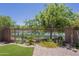 Enjoy a peaceful yard with a lush lawn, beautiful blooms, and a calming view of the water at 4700 S Fulton Ranch Blvd # 62, Chandler, AZ 85248
