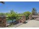 This inviting balcony overlooks the water and lush greenery, offering a peaceful retreat with stylish accents at 4700 S Fulton Ranch Blvd # 62, Chandler, AZ 85248
