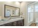 Modern bathroom with a glass vessel sink, dark cabinets, and a tiled shower at 4700 S Fulton Ranch Blvd # 62, Chandler, AZ 85248