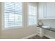 Well-lit bathroom nook with vanity, storage cabinets, and bright windows at 4700 S Fulton Ranch Blvd # 62, Chandler, AZ 85248