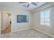 Light filled bedroom with television and window with plantation shutters at 4700 S Fulton Ranch Blvd # 62, Chandler, AZ 85248