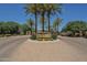 Landscaped entrance to Crescent Falls community with tall palm trees and stone signage at 4700 S Fulton Ranch Blvd # 62, Chandler, AZ 85248