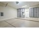 Epoxy floored garage featuring storage cabinets and a separate entrance at 4700 S Fulton Ranch Blvd # 62, Chandler, AZ 85248