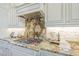 Elegant kitchen with granite countertops, custom cabinetry, and modern stainless steel appliances at 4700 S Fulton Ranch Blvd # 62, Chandler, AZ 85248