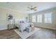 Relaxing main bedroom with a ceiling fan, a comfortable bed, and stylish decor at 4700 S Fulton Ranch Blvd # 62, Chandler, AZ 85248
