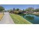 View of a pond with a decorative bridge surrounded by mature landscaping at 4700 S Fulton Ranch Blvd # 62, Chandler, AZ 85248