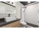 Updated bathroom featuring modern fixtures, vanity with storage and tiled shower at 4701 N 68Th St # 214, Scottsdale, AZ 85251
