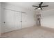 This bedroom features neutral carpet and a ceiling fan to ensure a comfortable and relaxing atmosphere at 4701 N 68Th St # 214, Scottsdale, AZ 85251