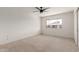Bright and airy bedroom featuring neutral carpet and a large window at 4701 N 68Th St # 214, Scottsdale, AZ 85251