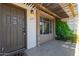 A welcoming townhome entrance with a covered patio and decorative greenery at 4701 N 68Th St # 214, Scottsdale, AZ 85251