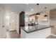 Modern kitchen features a breakfast bar, stainless steel appliances, and stylish pendant lighting at 4701 N 68Th St # 214, Scottsdale, AZ 85251