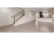 Spacious living room showcasing tile floors, staircase and seamless flow into the kitchen at 4701 N 68Th St # 214, Scottsdale, AZ 85251